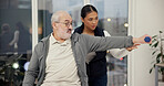 Dumbbell, physiotherapist and exercise with senior man in rehabilitation, help or muscle recovery. Physical therapy, woman and elderly patient weightlifting, fitness and health in medical clinic