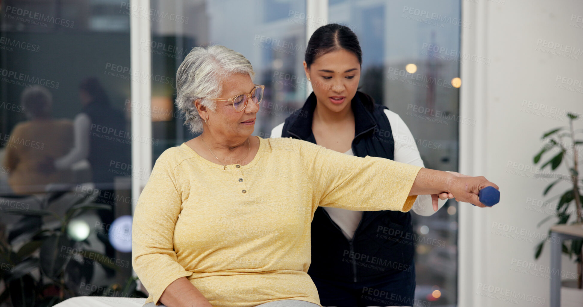 Buy stock photo Dumbbell, physiotherapist and exercise with senior woman in rehabilitation, help or muscle recovery. Physical therapy, people and elderly patient weightlifting, fitness and health in medical clinic