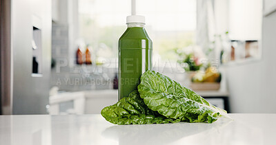 Buy stock photo Green, drink and bottle in kitchen for detox, vitamin ingredient and wellness benefits. Nutrition, gut health and morning beverage in home with juice container, supplement and vegetable for diet