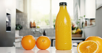 Buy stock photo Nutrition, juice or bottle on counter with orange, antioxidant or vitamin benefit in morning drink. Organic, digestion or fruit in house with detox diet, gut health or breakfast beverage in kitchen.