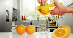 Hands, kitchen and juicer with orange for citrus, healthy diet and bottle with vitamin c. Nutrition, person and glass jar with fruit, organic beverage and natural drink for breakfast detox in home