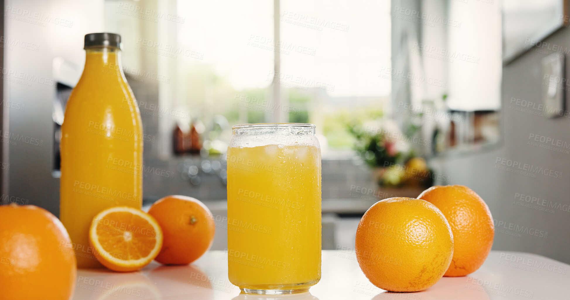 Buy stock photo Nutrition, bottle or glass in kitchen with orange juice, antioxidant or vitamin benefit in morning drink. Organic, hydration or fruit in house for digestion, gut health or detox in breakfast beverage