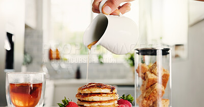 Buy stock photo Hands, person and syrup with pancakes in kitchen for meal prep, homemade breakfast and nutrition. Pour, honey and strawberry with tea of sweet treat, brunch dessert and hotcakes with beverage in home