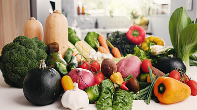 Buy stock photo Vegetables, organic groceries or kitchen counter with assorted ingredients, plant based diet or nutrition. Fresh produce, meal prep or variety of natural food for vegan menu, health and detox in home