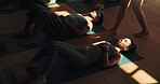 Above, meditation and yoga woman on floor in class for stress relief or wellness with coach. Breathing, exercise or shade with yogi people and personal trainer in studio for awareness or balance
