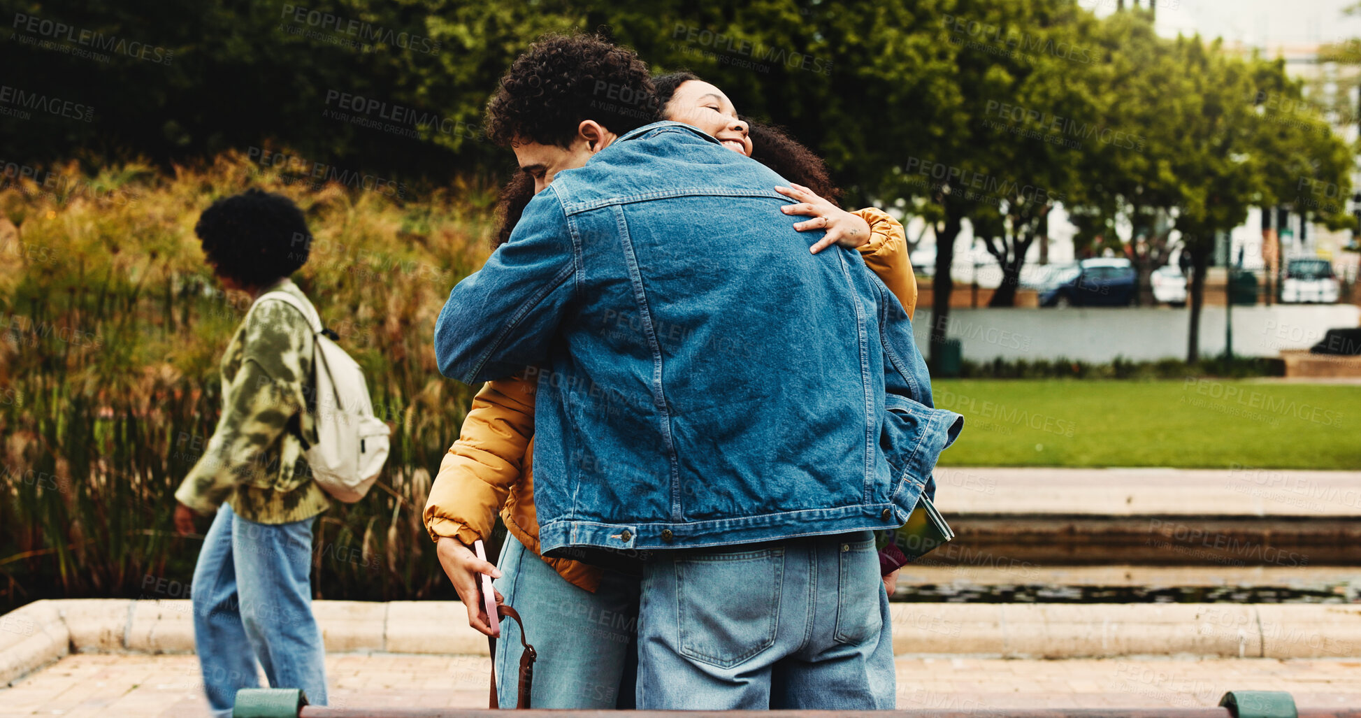 Buy stock photo Hug, outdoor and friends on university with bonding, connection or studying together on campus. Happy, education and students embracing for congratulations on exam, assignment or test at college.