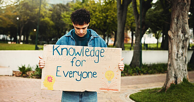 Buy stock photo Sign, man and student with protest on university for knowledge, studying or opportunity. Board, activist and male person with poster for debt, loans or tuition fees for education on college campus.