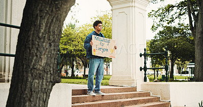 Buy stock photo Man, student and campus with poster for protest, education or knowledge of human rights in park. Male person, scholar or academic activist with sign or cardboard for learning development of humanity