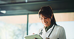 Happy, doctor and woman with tablet for medical info, patient history or telehealth in clinic. Tech, healthcare and mature person in hospital with insurance records, wellness email or research