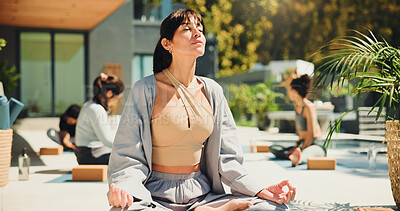 Buy stock photo Yoga, woman outdoor and meditation with lotus pose, spiritual awareness or chakra healing in resort. Zen, person and mindfulness exercise at retreat for inner peace, holistic health and soul cleanse.