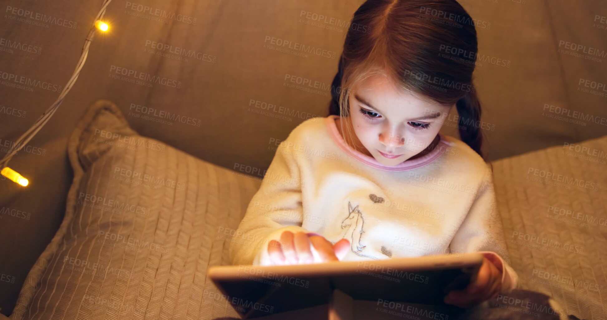Buy stock photo Night, child and scroll with tablet in bedroom for ebook, reading fantasy and bedtime story. Late, girl and relax with digital tech in home for online fairytale, kids storytelling app and literature.
