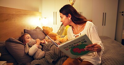 Buy stock photo Bedtime story, reading or night with mother and daughter in home together for sleep routine. Evening, book or storytelling with girl child and single parent woman in bedroom of apartment for bonding