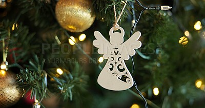 Buy stock photo Christmas, decoration and festive with angel on tree in home for celebration, event or tradition. Background, holiday and wallpaper with ornament in apartment for aesthetic, vacation or winter season