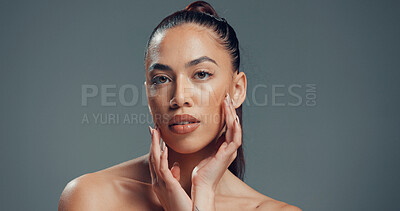 Buy stock photo Hands, skincare and portrait of woman in studio for beauty, self care and clear skin. Glow, dermatology and hydration with female person on gray background space for shine, aesthetic and collagen