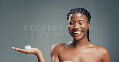Buy stock photo Skincare, cream and portrait of black in studio for beauty, glow and self care cosmetics. Shine, dermatology and aesthetic with person and lotion on gray background space for clear skin and hydration