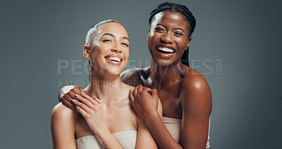 Buy stock photo Skincare, portrait and smile with friends in studio for beauty, glow or self care diversity. Shine, dermatology and aesthetic with women on gray background space for clear skin, hydration and support