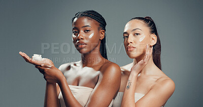 Buy stock photo Skincare, cream and portrait of women in studio for beauty, glow and self care diversity. Shine, dermatology and aesthetic with people on gray background for lotion, hydration and spa treatment