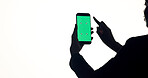Phone, green screen and woman in studio with networking, communication or social media on mobile app. Cellphone, space and female person with technology for contact with email by white background.