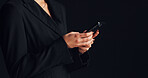 Cellphone, hands and businesswoman in studio with networking, communication or social media on app. Technology, typing and female person with phone for email, online or contact by black background.