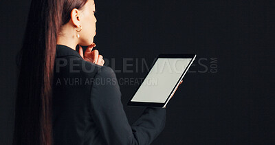 Buy stock photo Business, woman and thinking with tablet in studio for case review, legal solution and lawsuit insight. Mockup space, digital screen and back of lawyer on black background with decision for justice