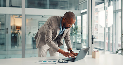 Buy stock photo Typing, businessman and laptop in office, paperwork and financial analysis on web, research and info. Investment banker, black person and plan for pitch with tech, documents and checking market data