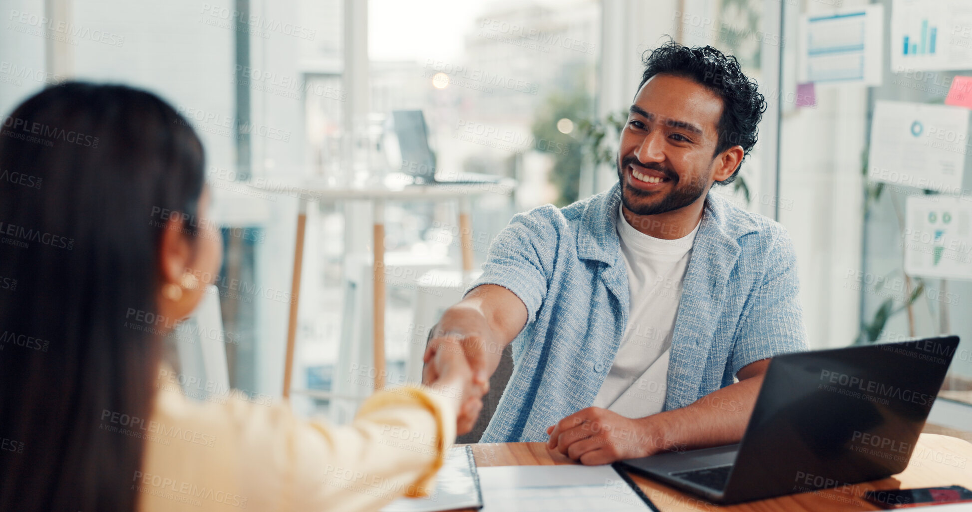 Buy stock photo Happy, businessman or handshake with laptop for interview, hiring or job opportunity in office. Man, woman or shaking hands with candidate for recruiting, onboarding process or agreement in workplace