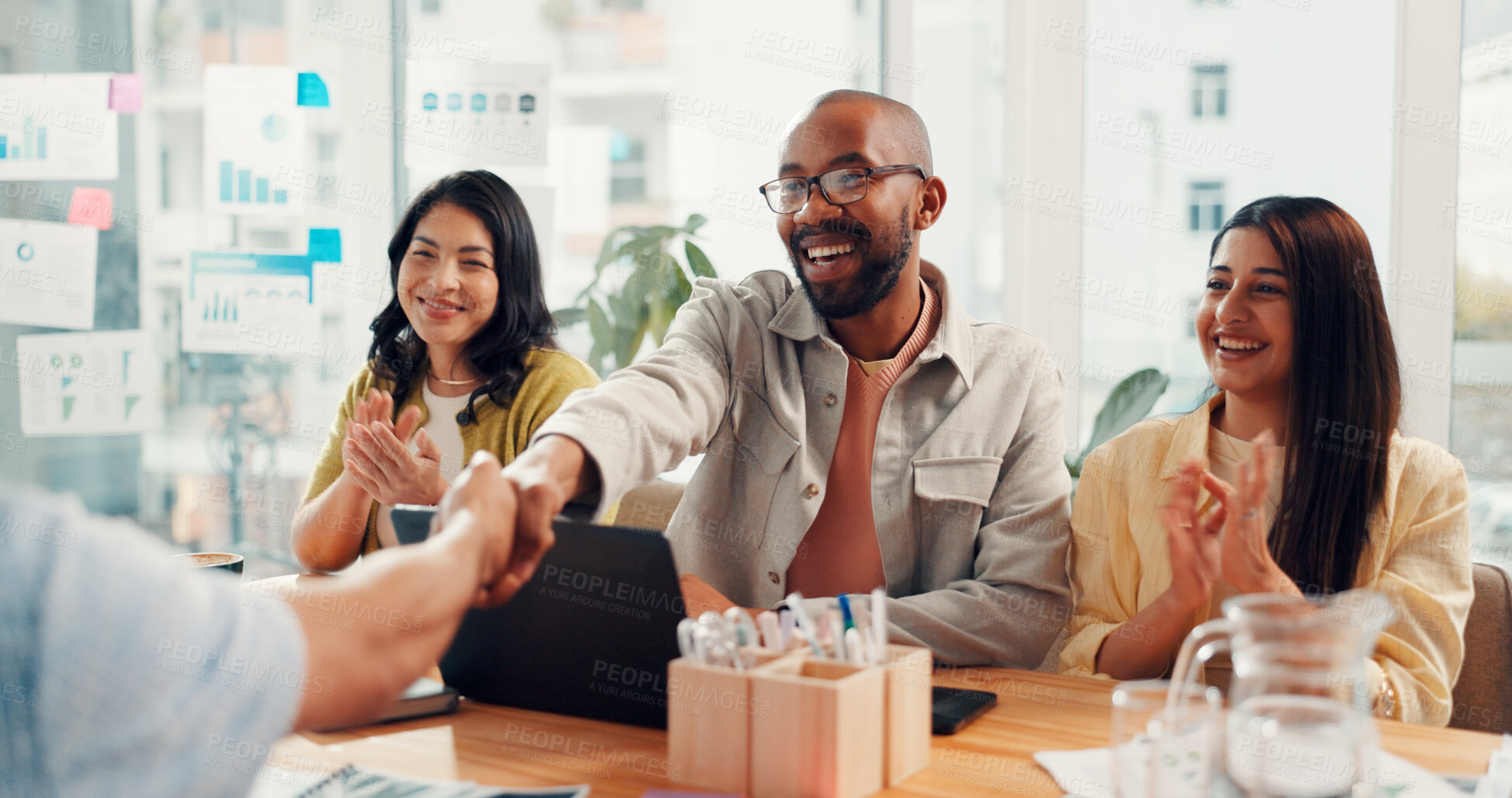 Buy stock photo Man, handshake and applause with meeting at startup, goal or celebration for success at office. Men, women and excited team with agreement, shaking hands or collaboration with deal at digital agency