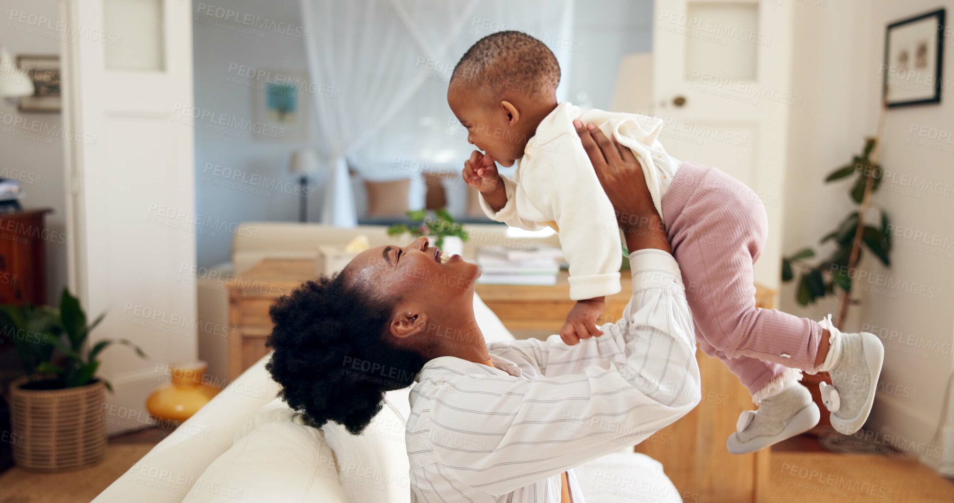 Buy stock photo Smile, mother and play with baby at house for airplane, flying games and bonding together. Happy, black family and lifting infant in air for fun activity, support and connection of growth development