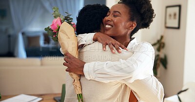 Buy stock photo Flowers, hug and romance with black couple in home living room together for anniversary or love. Bonding, roses and smile of woman embracing man in apartment for celebration, milestone or thank you