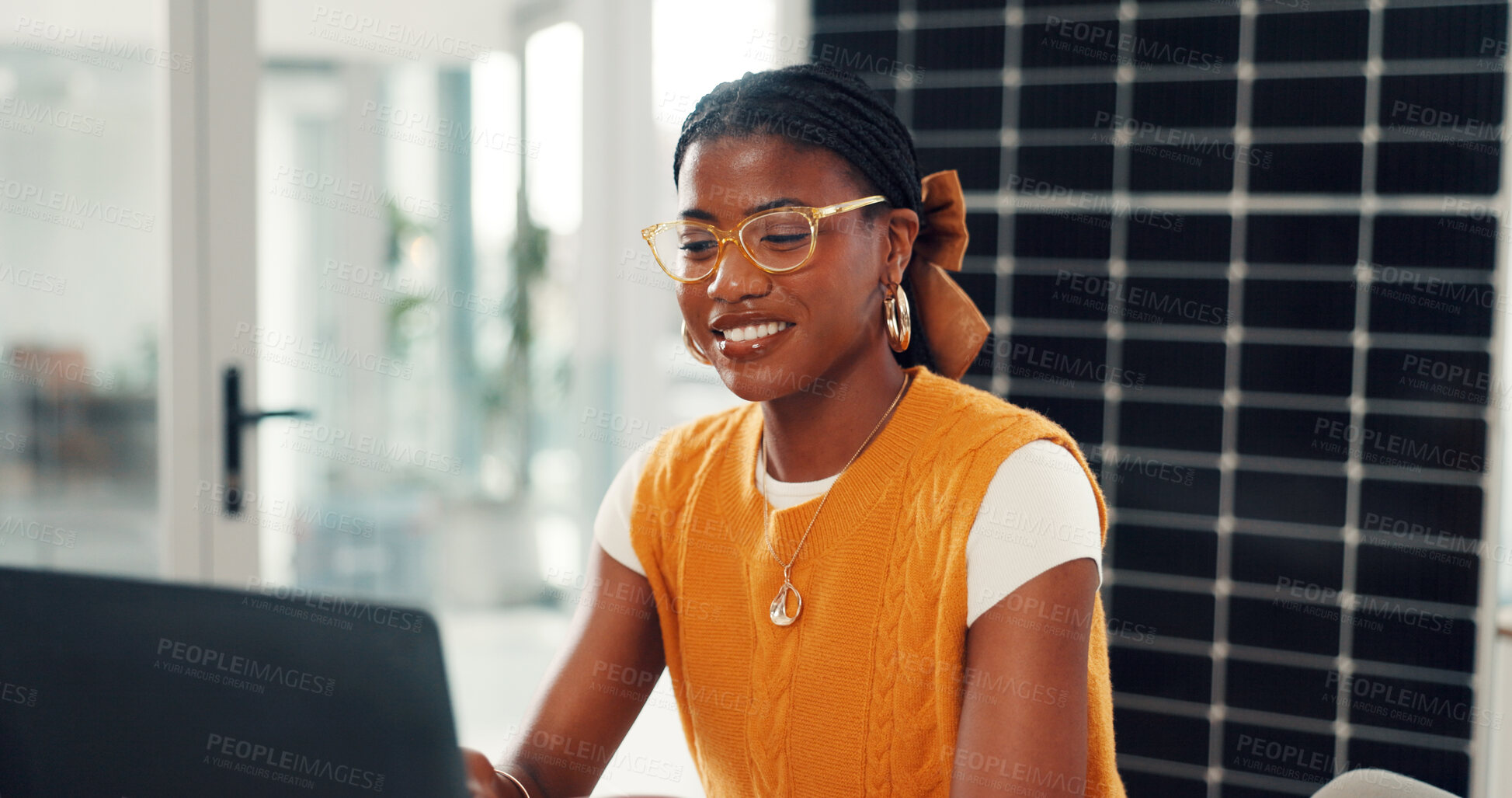 Buy stock photo Business, solar panels and black woman in office, laptop and smile with research for sustainability. African person, pc and employee with photovoltaic grid, planning and feedback for ecology report