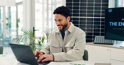 Buy stock photo Smile, solar panels and man in office, laptop and planning with research for sustainability. Happy person, pc and employee with photovoltaic grid, internet and feedback for ecology report or email