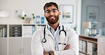 Portrait, doctor and man in hospital, arms crossed and career ambition with smile. Happy person, medical service or professional in clinic, healthcare and confidence with support, pride or cardiology