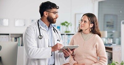 Buy stock photo Conversation, healthcare or tablet with doctor and patient in hospital for planning, research or review of records. Advice, app or medical with man and woman in clinic for feedback or results