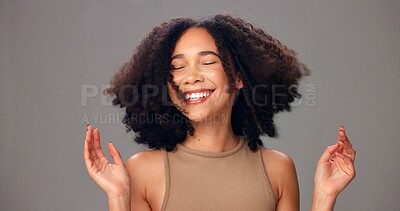 Buy stock photo Happy woman, haircare and beauty with curls in studio for cosmetics on a gray background. Female person, model or smile with spa hair, health or wellness for fashion, style or salon treatment 