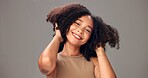 Haircare, portrait and woman in studio, growth or maintenance of texture, shine and white background. Happy, African person and confident for healthy hair, mockup space and self care for hairstyle
