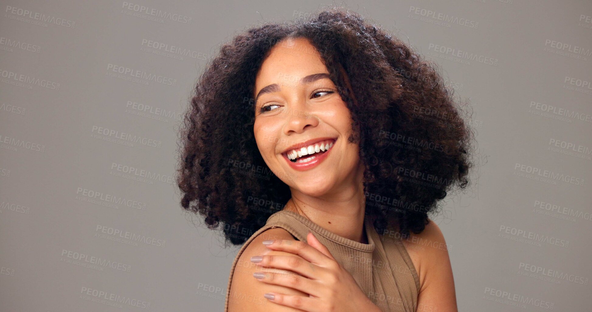 Buy stock photo Happy woman, haircare and beauty with curls in studio for fashion on a gray background. Female person, model or smile with frizz for hair style, cosmetics or skincare in salon or spa on mockup space