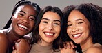 Happy women, portrait and beauty with diversity, skin tone or cosmetics on studio background. Female people, interracial or multiracial with smile for skincare, health or wellness in salon or spa