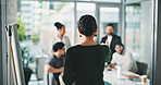 Business woman, back view and presentation with team for meeting, project management or delegation. Female person, employee or coordinator with group for brainstorming strategy or tasks in workplace