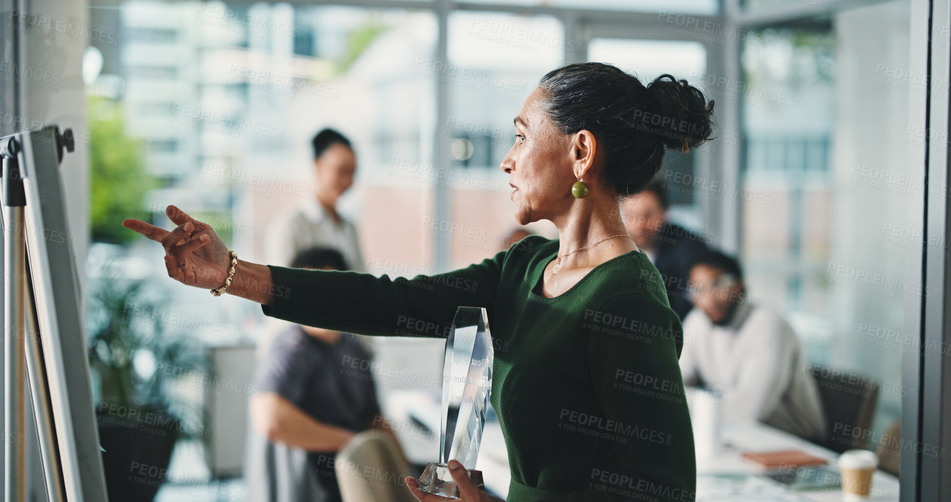 Buy stock photo Business woman, presentation and trophy with team, whiteboard or meeting for nomination in office. Female person, employee or coach with group or award for top performance or delegation in workplace