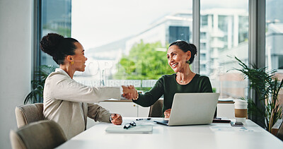 Buy stock photo Handshake, meeting and business women for partnership, deal or thank you in office. B2B merger, laptop or shaking hands for welcome, congratulations or client introduction for collaboration agreement