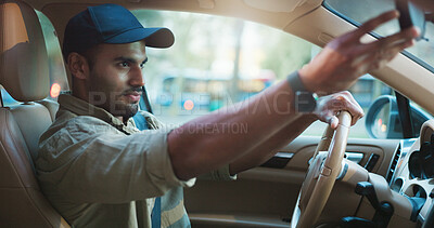 Buy stock photo Checking, mirror and transport with man in car for commute or travel to city location. Ride, route and trip safety with driver in motor vehicle for journey or transportation to urban destination