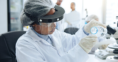 Buy stock photo PPE, sample and science with woman in laboratory for development, investigation or medical research. Analysis, pouring and visor with doctor at work on chemical reaction, clinical trial or experiment