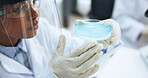 Scientist, woman and petri dish in laboratory for chemistry, research or vaccine development. Science, chemical and person with glass for medical innovation, study liquid or test with safety PPE