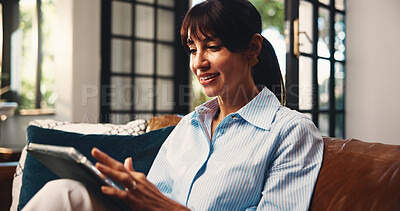 Buy stock photo Tablet, smile and woman in home for freelance article, editing newsletter or research. Technology, mature copywriter and remote work in living room for story update, review headline and reading email