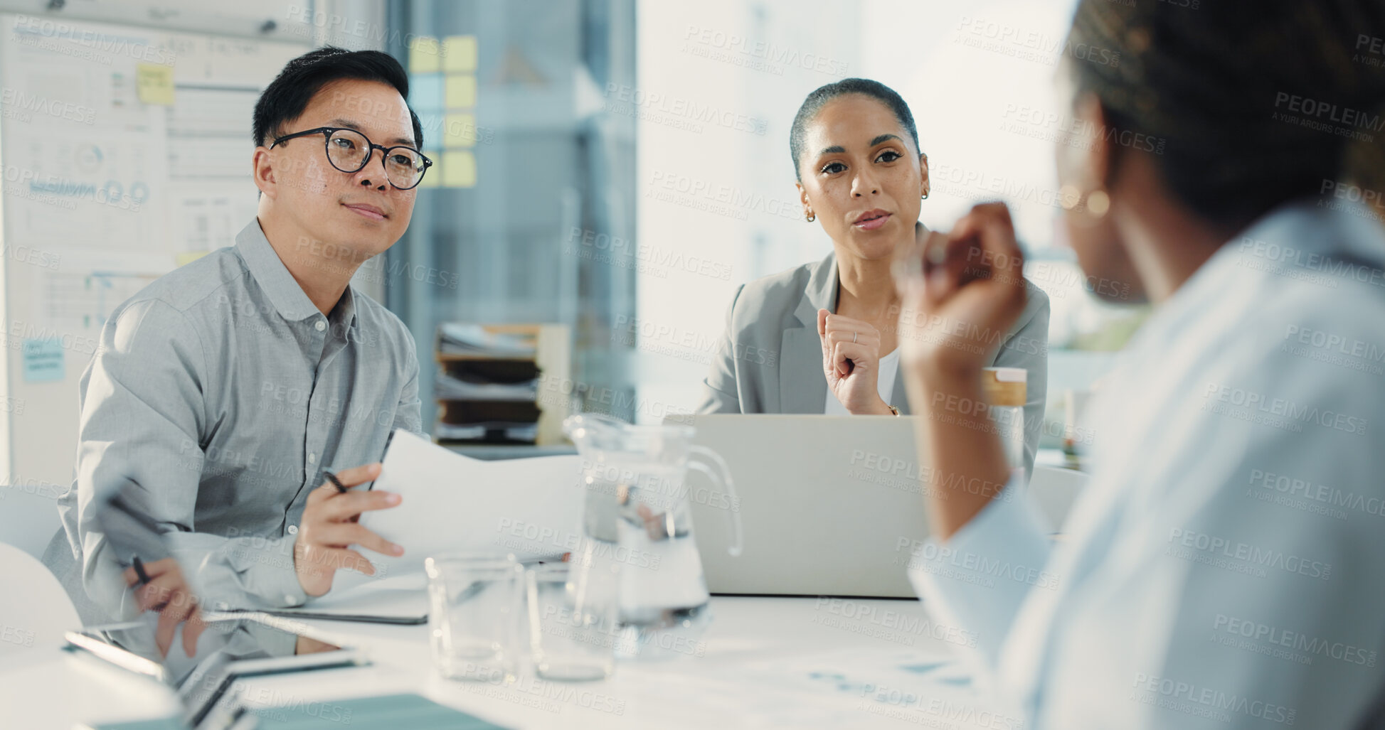 Buy stock photo Business people, laptop and meeting with collaboration for document, proposal or accounting report at office. Group of employees, paperwork or feedback for company revenue, profit or financial growth