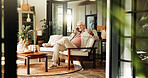 Senior man, relax and phone call in home for communication, story or chat in retirement. Mobile, smile and elderly person in living room with contact for connection, news or talking with question