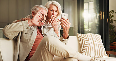 Buy stock photo Gesture, phone and video call with old couple in living room of home together for break or wellness. App, blowing kiss and wave with happy senior people in apartment for bonding or communication
