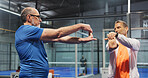 Padel, fitness and men on court stretching to prepare for game, match and competition. Indoor, sports and mature people warm up for exercise, workout and training for practice, health and tennis