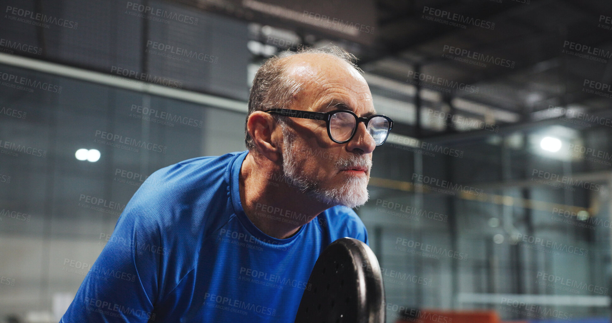 Buy stock photo Padel, sports and mature man ready for game, tournament and competition on indoor court. Tennis, senior athlete and person with racket for training, exercise and workout for challenge and fitness