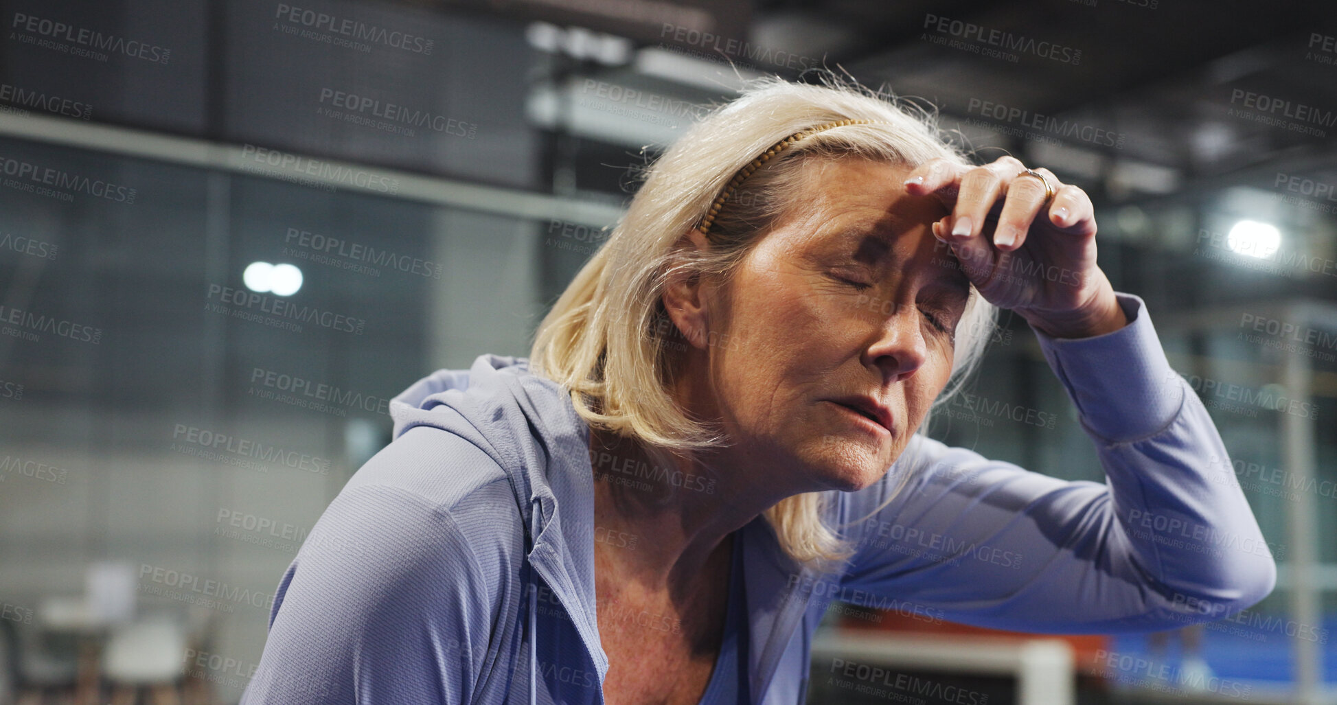 Buy stock photo Padel, senior and woman with sweat, tired and rest after game, match and training for challenge. Indoor court, sports and person on break, breathe and fatigue for tennis workout, exercise and fitness